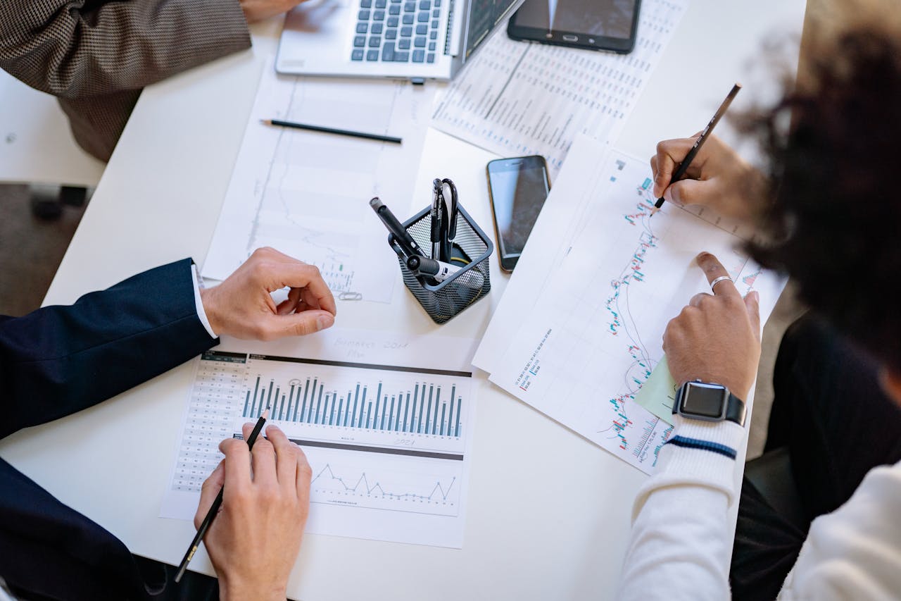 Quality Management Audits - Image shows a meeting room with people looking at charts, and other issues