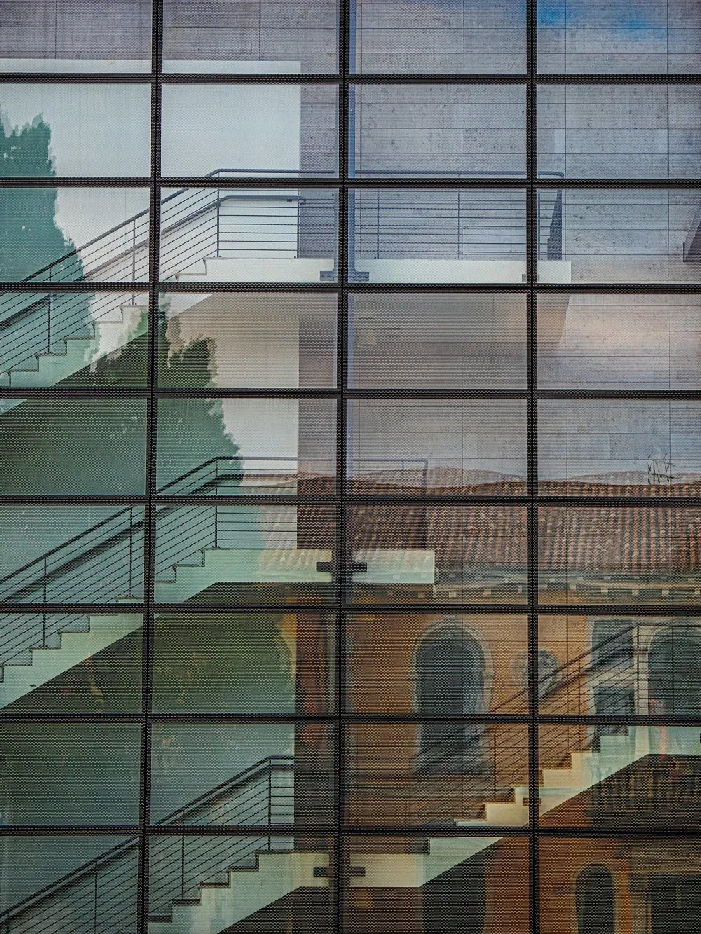 Critical Issues Response - Image shows a building front with glass
